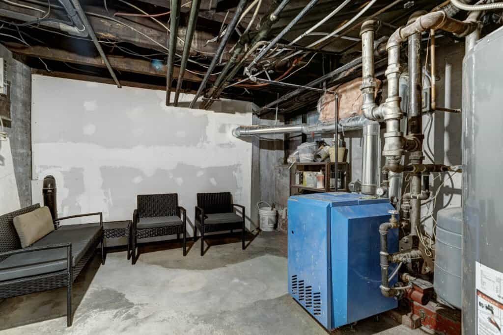 Water damage restoration equipment in a basement setting.